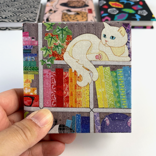 Tiny Cats on the Bookshelf